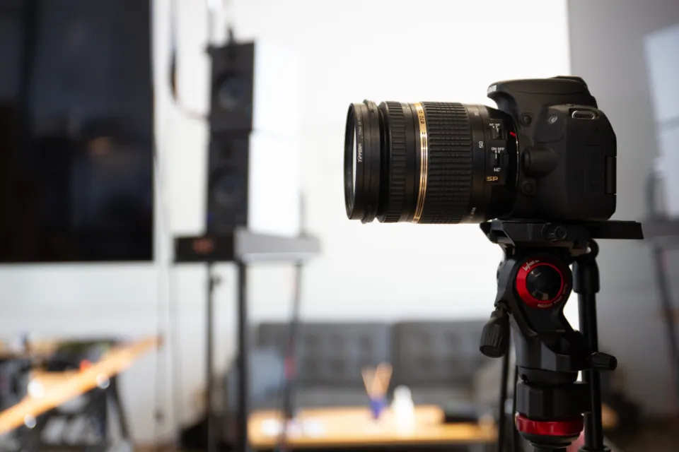 A camera on a tripod in a studio