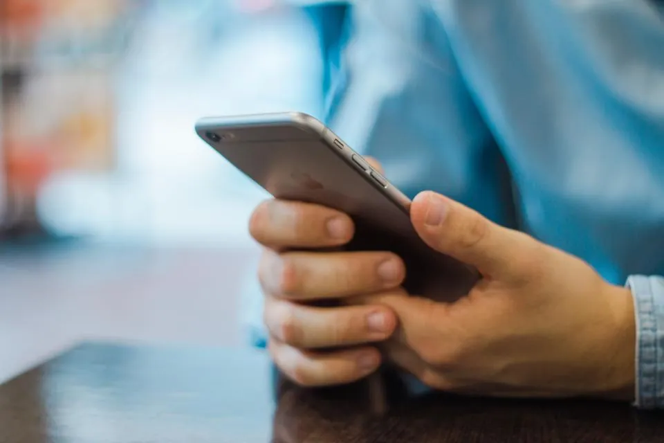 Two hands holding a smartphone